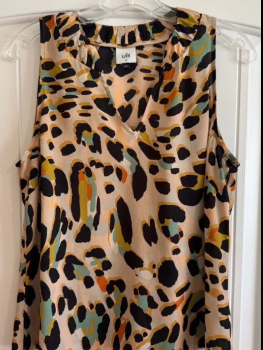 CAbi Sleeveless V-Neck Josie Top in Beige with Black, Green & Orange Spots